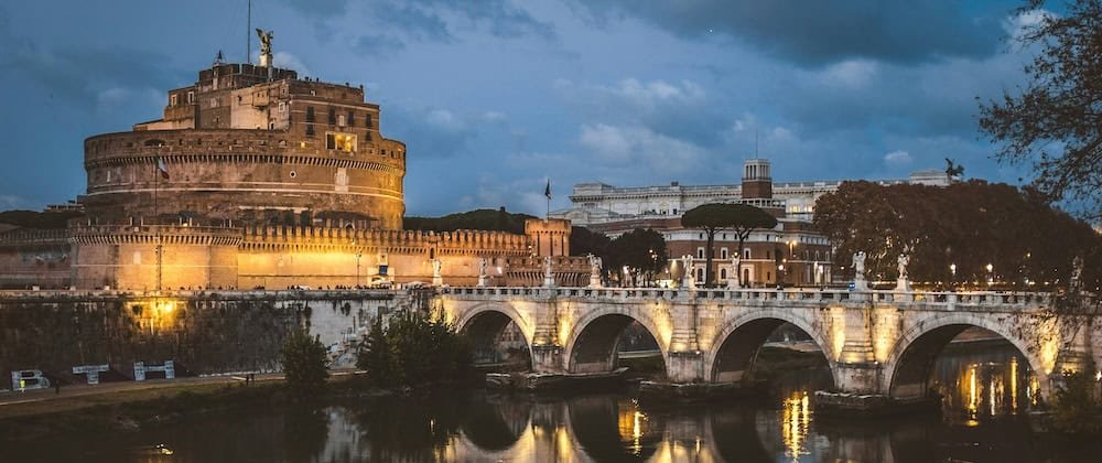 Castel Sant'Angelo and the Ponte Sant'Angelo in Rome, lit up in the evening